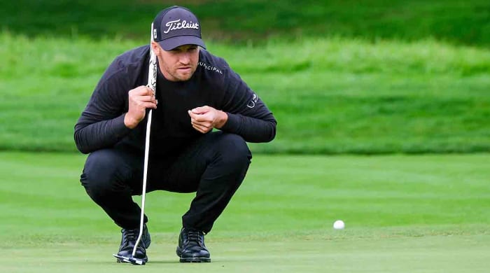 Wyndham Clark lines up a putt during the third round of the AT&T Pebble Beach Pro-Am tournament on Feb. 3, 2024 in Monterey, Calif.
